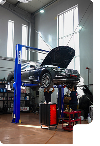 Car on lift in workshop